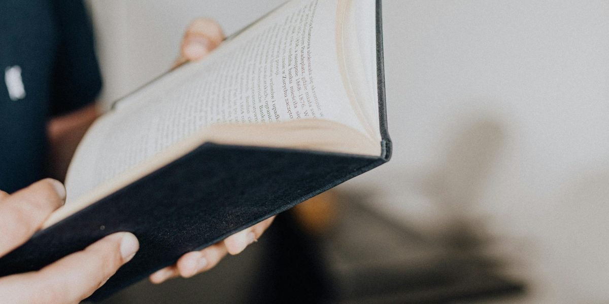 A person engrossed in a book, reflecting the immersive experience of a targeted reading journey.