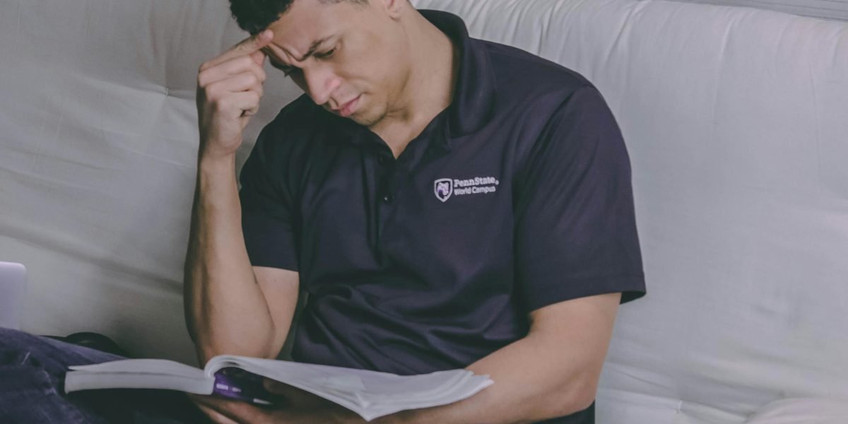 A reader lost in thought, reflecting on a profound and lasting story.
